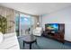 Elegant living area with balcony access, modern amenities, and comfortable furnishings, designed for relaxation at 107 S Ocean Blvd. # 1706, Myrtle Beach, SC 29577
