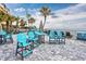 Outdoor seating area with tables and chairs overlooking the ocean and sandy beach at 107 S Ocean Blvd. # 1706, Myrtle Beach, SC 29577