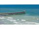 Scenic view of a wooden pier extending into the ocean, with waves crashing along the shore at 107 S Ocean Blvd. # 1706, Myrtle Beach, SC 29577