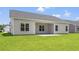 Back of house featuring an open patio and a large backyard at 119 Old Chimney Ln, Conway, SC 29526
