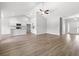 Spacious living room with hardwood floors, neutral walls, and a clear view into the kitchen area at 119 Old Chimney Ln, Conway, SC 29526
