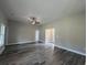 This expansive living room features durable floors, neutral paint, and ample natural light at 126 Palm Dr., Loris, SC 29569