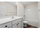 Bright bathroom features a white vanity, toilet, and shower-tub combo with modern fixtures at 127 Old Chimney Ln, Conway, SC 29526