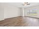 Spacious living room with hardwood floors, a ceiling fan, and large windows at 127 Old Chimney Ln, Conway, SC 29526