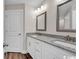 Contemporary bathroom with dual vanities, granite countertops, and modern lighting at 130 Palm Dr., Loris, SC 29569