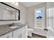 Contemporary bathroom showcasing a vanity with granite counters and tile floors at 130 Palm Dr., Loris, SC 29569