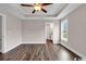 Large main bedroom featuring hardwood floors and a ceiling fan at 130 Palm Dr., Loris, SC 29569