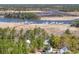 Aerial view showcases a waterway and surrounding trees around the home with a view of a marina at 1539 Old Town Ave., Georgetown, SC 29440