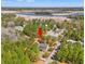 Aerial view of a beautiful home surrounded by trees, with a river and marina in the distance at 1539 Old Town Ave., Georgetown, SC 29440