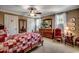 Cozy bedroom featuring a bed with patterned quilt, natural light, and classic decor with wooden furniture at 1539 Old Town Ave., Georgetown, SC 29440
