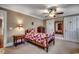 Bedroom with a bed featuring patterned quilt, side tables, natural light, and carpeted floor at 1539 Old Town Ave., Georgetown, SC 29440