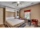 Comfortable bedroom featuring Murphy bed, ceiling fan, window, and two chairs at 1539 Old Town Ave., Georgetown, SC 29440