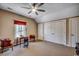 Spacious bedroom with ceiling fan, three closets, a small table, and two chairs at 1539 Old Town Ave., Georgetown, SC 29440