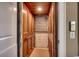 Home elevator featuring wooden paneling, a metal gate, and carpet, for easy access between floors at 1539 Old Town Ave., Georgetown, SC 29440