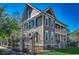Charming two-story home with a landscaped yard, wrought iron fence, and inviting front porch at 1539 Old Town Ave., Georgetown, SC 29440