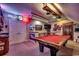 Well-appointed game room with pool table, custom lighting, and stylish décor at 1539 Old Town Ave., Georgetown, SC 29440