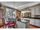Kitchen featuring granite countertops, a breakfast bar with seating, and hardwood floors at 1539 Old Town Ave., Georgetown, SC 29440