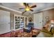 Inviting living room with a bookshelf, a leather chair and hardwood floors, creating a cozy and stylish space at 1539 Old Town Ave., Georgetown, SC 29440