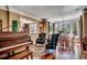 Elegant living room with hardwood floors, piano, and a dining area with natural light at 1539 Old Town Ave., Georgetown, SC 29440