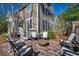 Cozy outdoor patio with comfortable seating around a fire pit, perfect for relaxing evenings at 1539 Old Town Ave., Georgetown, SC 29440