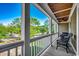 Charming porch with outdoor seating, ceiling fan, and scenic views of the neighborhood at 1539 Old Town Ave., Georgetown, SC 29440