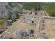 An aerial view of the home and surrounding acreage shows the private setting and distance to nearby highway at 1651 Circle Bay Dr., Longs, SC 29568