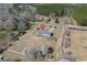 Aerial view of property featuring a well-maintained lawn and mature trees surrounding the home at 1651 Circle Bay Dr., Longs, SC 29568