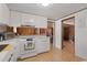 Modern kitchen with stainless steel appliances and bright lighting that looks into the living room at 1651 Circle Bay Dr., Longs, SC 29568