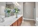 Bathroom featuring a double sink vanity and ample lighting at 169 Northside Dr., Little River, SC 29566