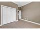Bedroom showing a large closet, neutral wall paint, and access to other rooms in the home at 169 Northside Dr., Little River, SC 29566