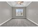 Neutral bedroom with high ceiling and large window at 169 Northside Dr., Little River, SC 29566