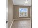 Bedroom showcasing tile flooring, neutral wall paint, and a window bringing in natural light at 169 Northside Dr., Little River, SC 29566