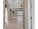 A light-filled foyer with tiled flooring, high ceilings, and arched doorways leading to other rooms at 169 Northside Dr., Little River, SC 29566