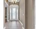 Spacious entry foyer featuring an ornate glass front door, tile floors, and neutral wall paint at 169 Northside Dr., Little River, SC 29566
