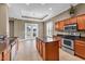 Kitchen with stainless steel appliances, granite countertops, island, and outdoor access at 169 Northside Dr., Little River, SC 29566
