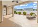 Covered patio with ceiling fans, decorative concrete, and backyard views at 169 Northside Dr., Little River, SC 29566