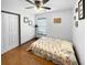 Bedroom with fan, wood flooring, closet, and natural light at 1908 Gasparilla Ct., Myrtle Beach, SC 29588