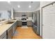 Modern kitchen featuring stainless steel appliances, stylish gray cabinets, and a view to the breakfast bar at 1908 Gasparilla Ct., Myrtle Beach, SC 29588