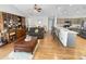 Cozy living room featuring hardwood floors, vaulted ceilings, and an open floorplan with view to kitchen at 1908 Gasparilla Ct., Myrtle Beach, SC 29588