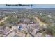 Aerial view of a neighborhood near the Intracoastal Waterway showcasing scenic views and lush surroundings at 20 Brassie Dr., Carolina Shores, NC 28467