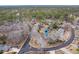 Aerial view of a home with a golf course nearby and mature landscaping at 20 Brassie Dr., Carolina Shores, NC 28467