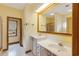 Well-lit bathroom with double vanity, modern fixtures, a large mirror, and a separate shower at 20 Brassie Dr., Carolina Shores, NC 28467