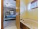 Bathroom featuring a soaking tub with a view into the bedroom, offering a spa-like retreat at 20 Brassie Dr., Carolina Shores, NC 28467