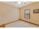 Cozy bedroom with neutral paint, ceiling fan, and a window providing natural light at 20 Brassie Dr., Carolina Shores, NC 28467