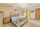 Comfortable bedroom featuring a large bed, side tables, and coordinated artwork at 20 Brassie Dr., Carolina Shores, NC 28467