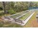 Outdoor bocce ball court with spectator seating at 20 Brassie Dr., Carolina Shores, NC 28467