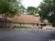 Exterior of the Carolina Shores Clubhouse, with ample parking at 20 Brassie Dr., Carolina Shores, NC 28467