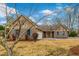 Beautiful brick home featuring a spacious driveway, two car garage and blue shutters at 20 Brassie Dr., Carolina Shores, NC 28467