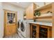 Functional laundry room with modern washer and dryer, cabinets, and ample countertop space at 20 Brassie Dr., Carolina Shores, NC 28467