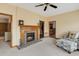 Cozy living room featuring a brick fireplace and access to other rooms at 20 Brassie Dr., Carolina Shores, NC 28467